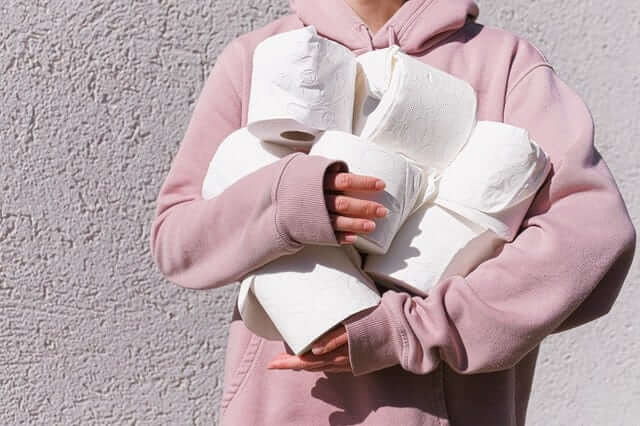 woman holding toilet paper